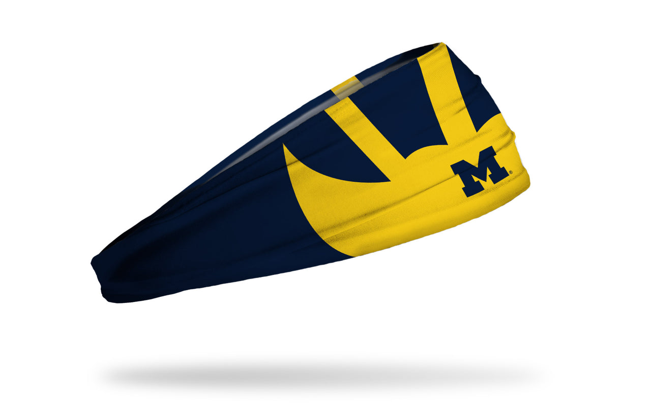 navy headband with University of Michigan winged helmet design in gold