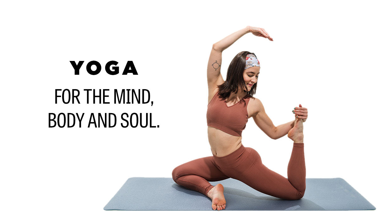 Claire sits in a yoga pose with a blue yoga matte in rust colored yoga attire. The text overlay reads Yoga for the mind, body and soul. 