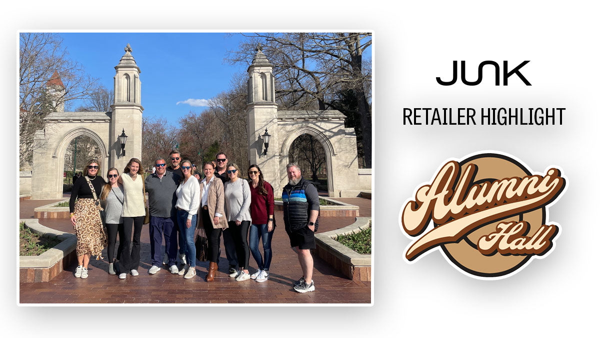 Text says Junk retailer highlight and has the alumni hall logo. On the left are 11 people standing in front of a college entrance. 