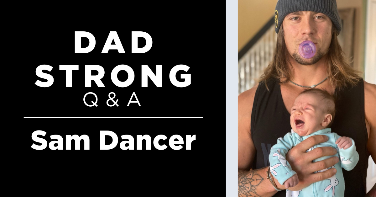 image of long haired dad with baby, text reads dad strong Q&A: Sam Dancer