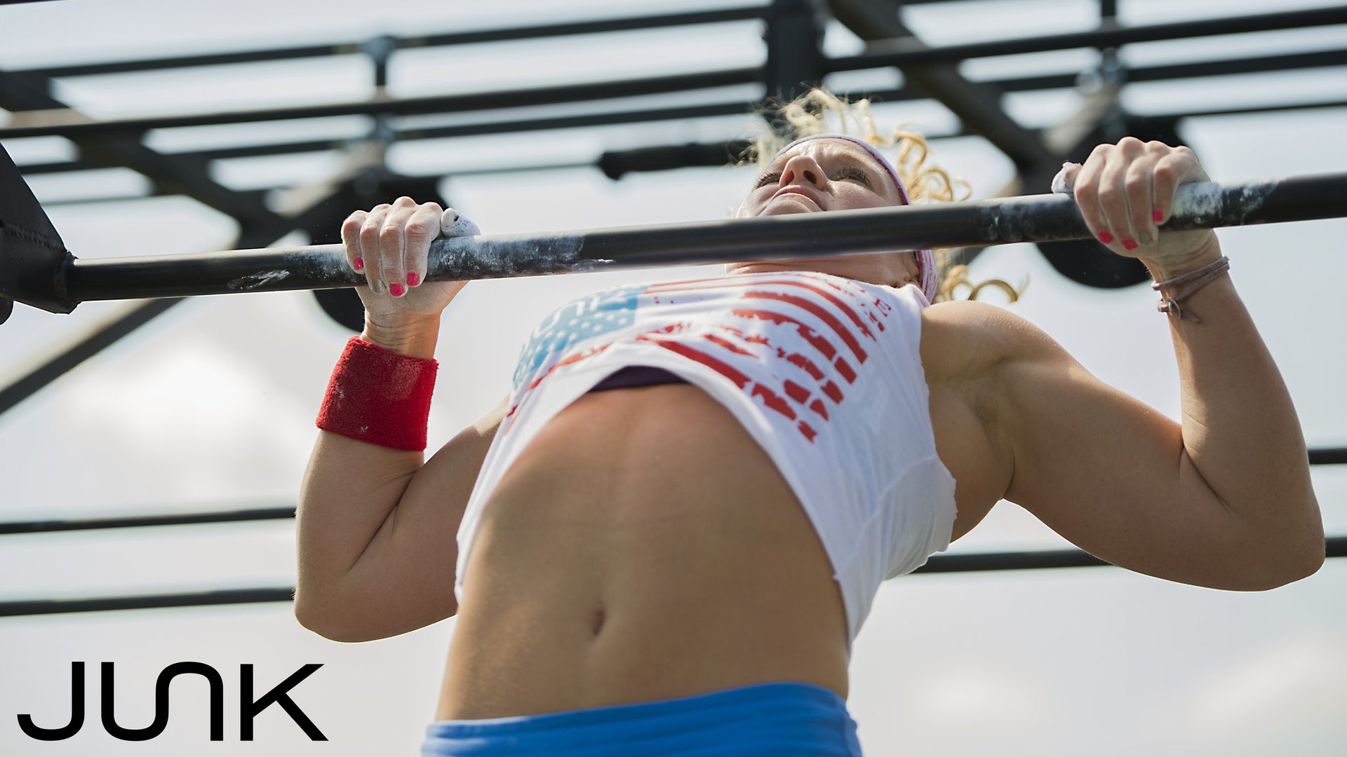 Woman performing chest to bar pull ups for the memorial day murph
