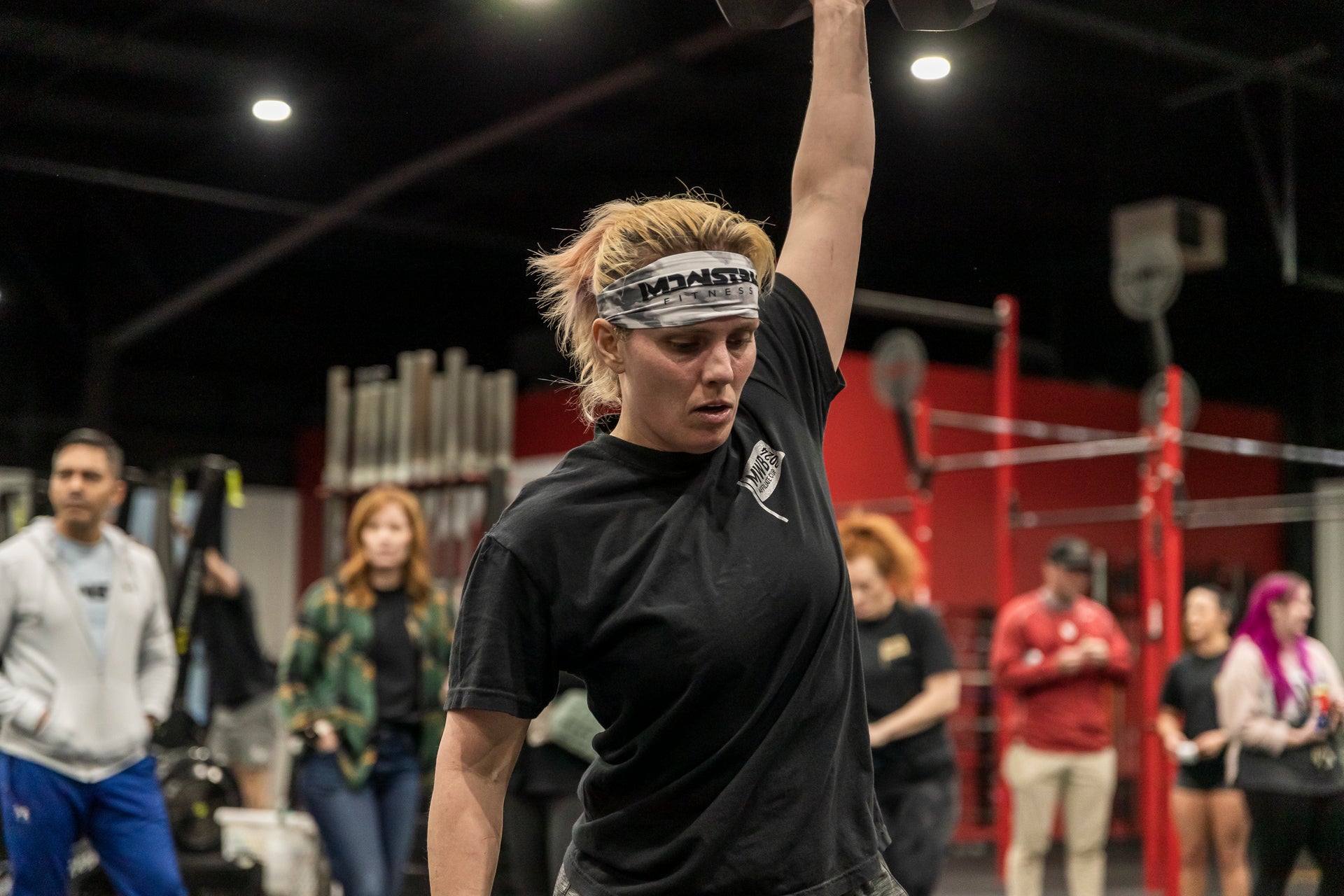Image of woman working out in headband headband