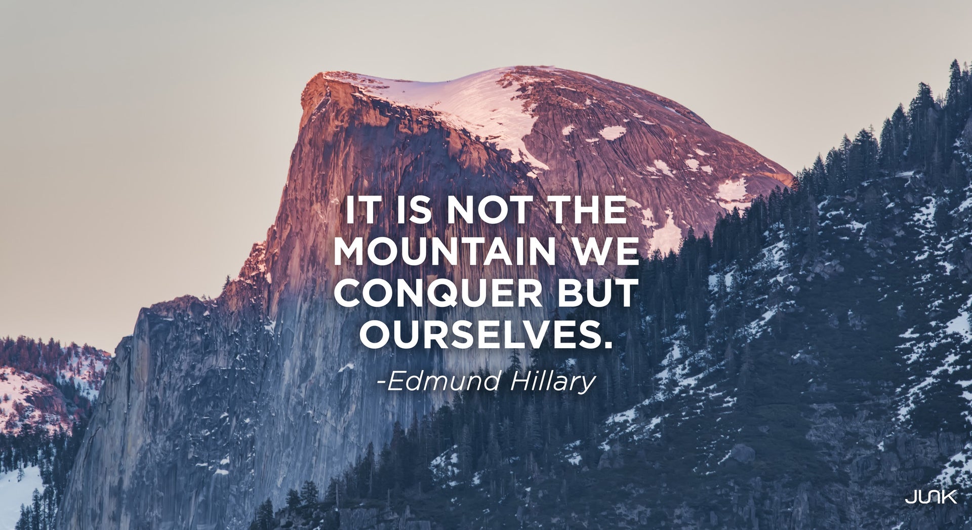 mountain range with quote reading it is not the mountain we conquer but ourselves