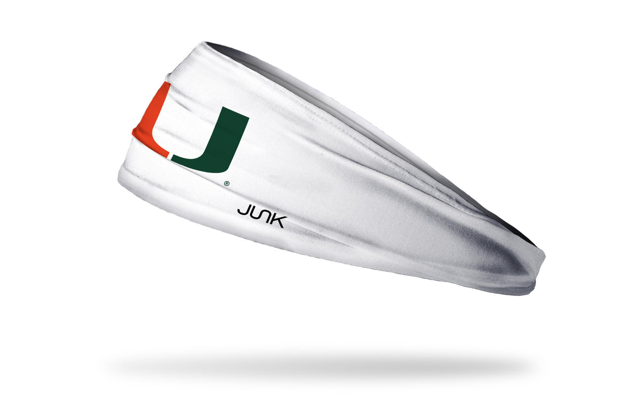 white headband with University of Miami U logo in orange and green
