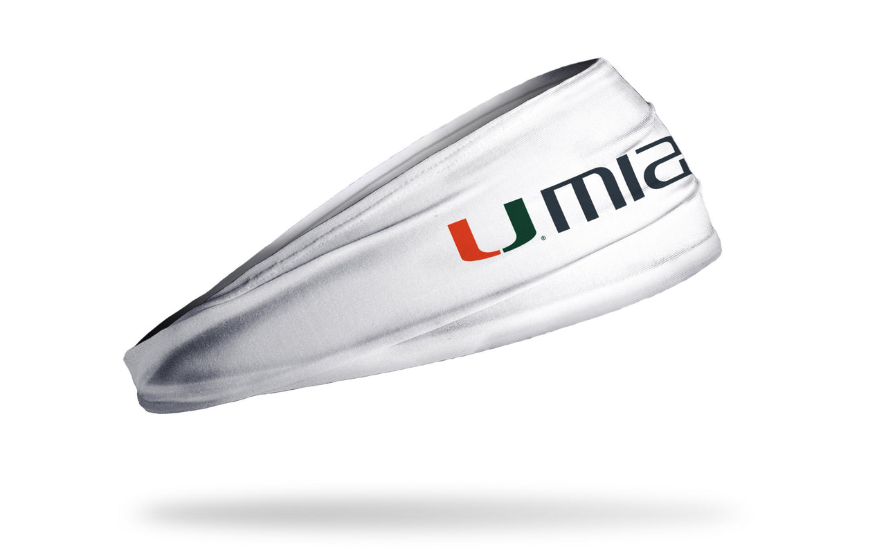 white headband with University of Miami U logo in orange and green and miami wordmark to right in grey