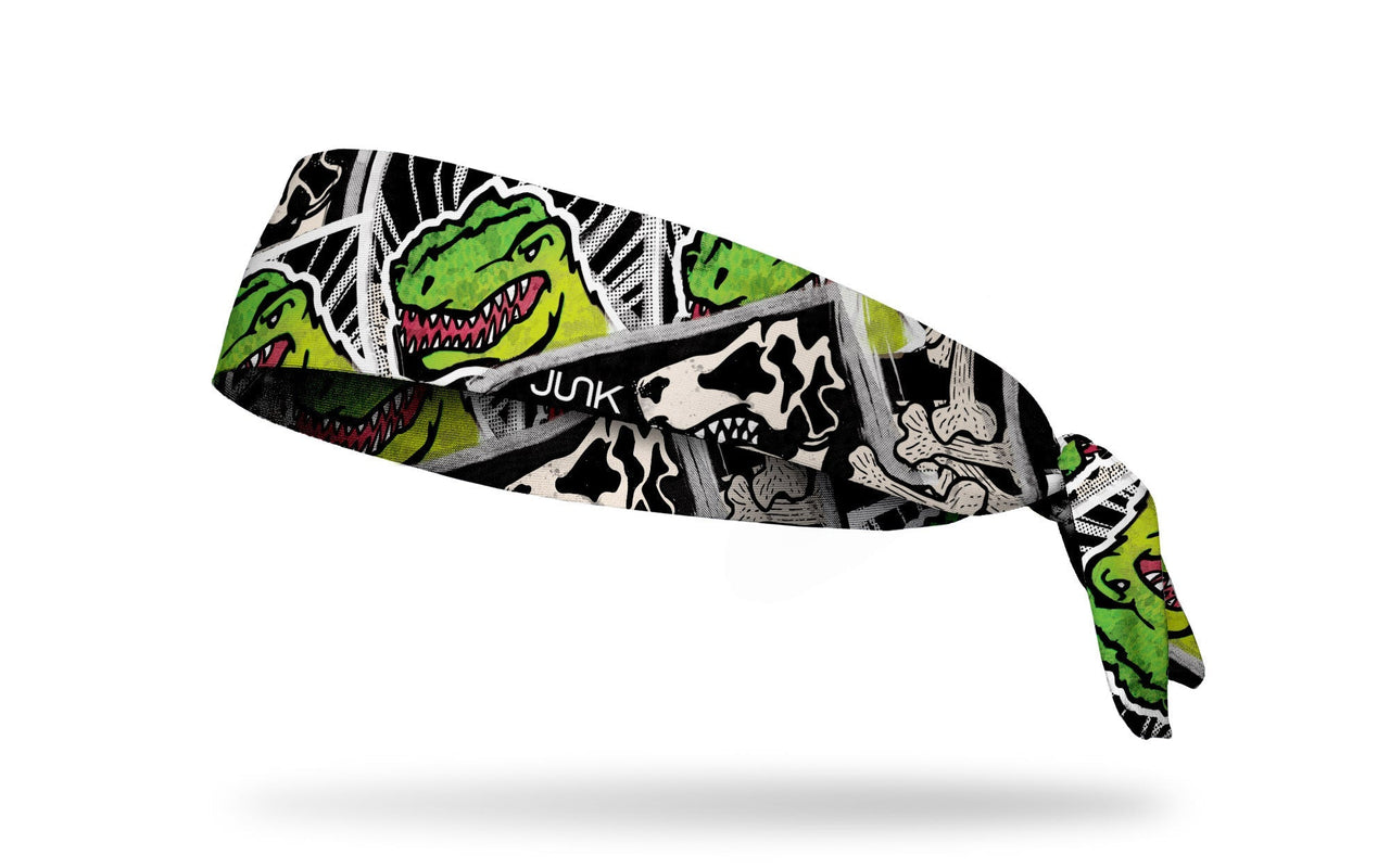 black and white dinosaur themed headband with bright green t-rex focus
