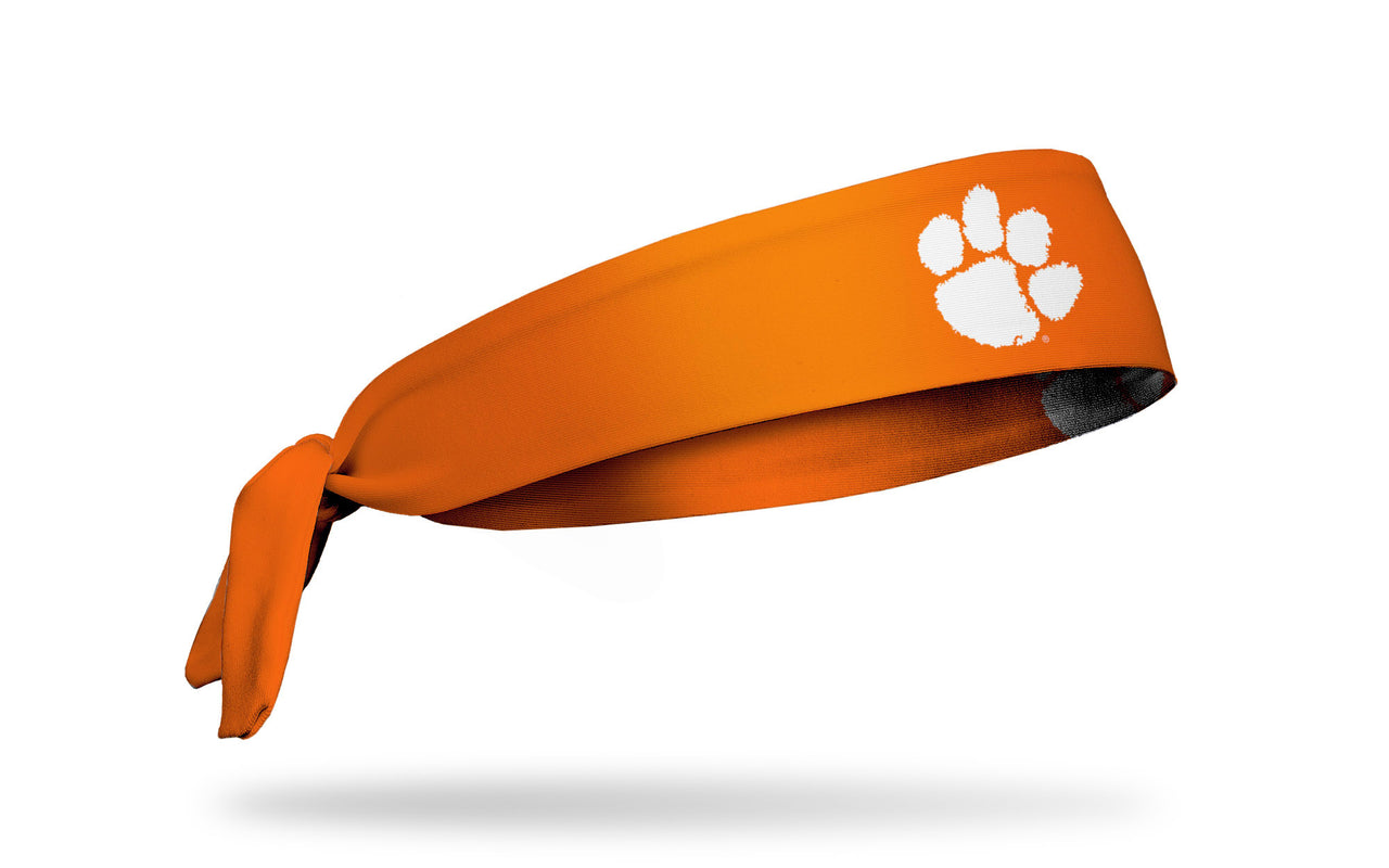 orange headband with Clemson University paw print logo in white