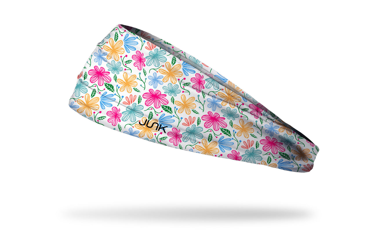white headband with yellow pink and blue floral daisy print