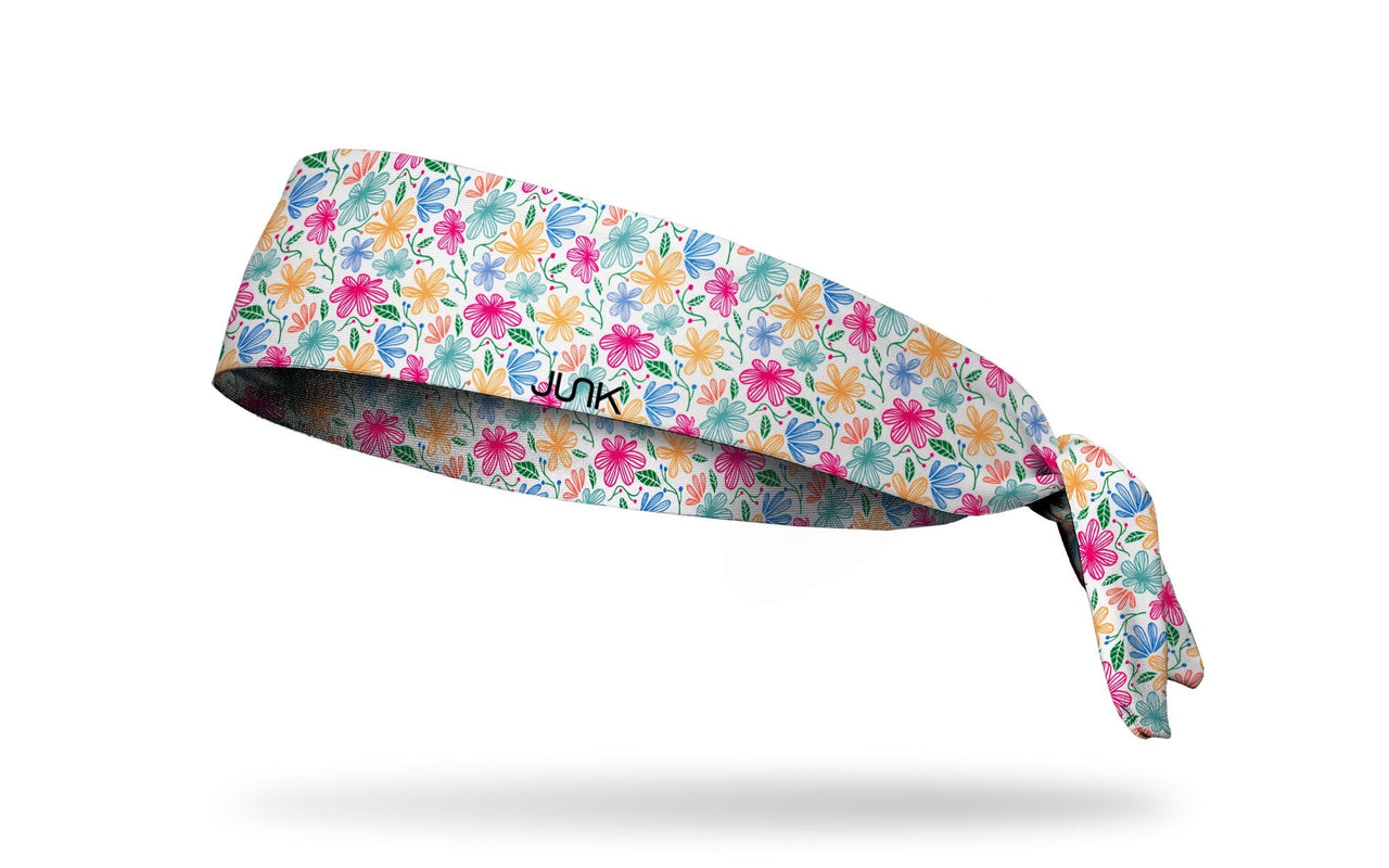 white headband with yellow pink and blue floral daisy print
