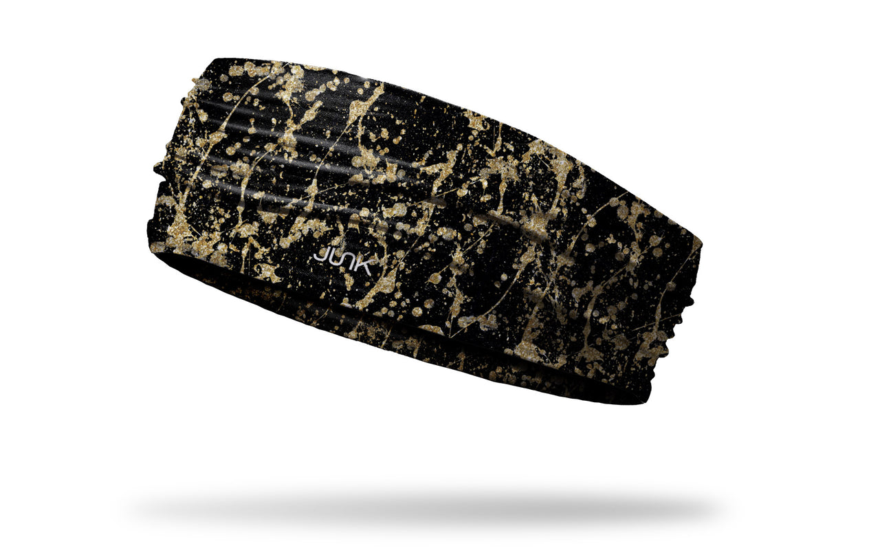 black headband with gold paint splatter and drip design