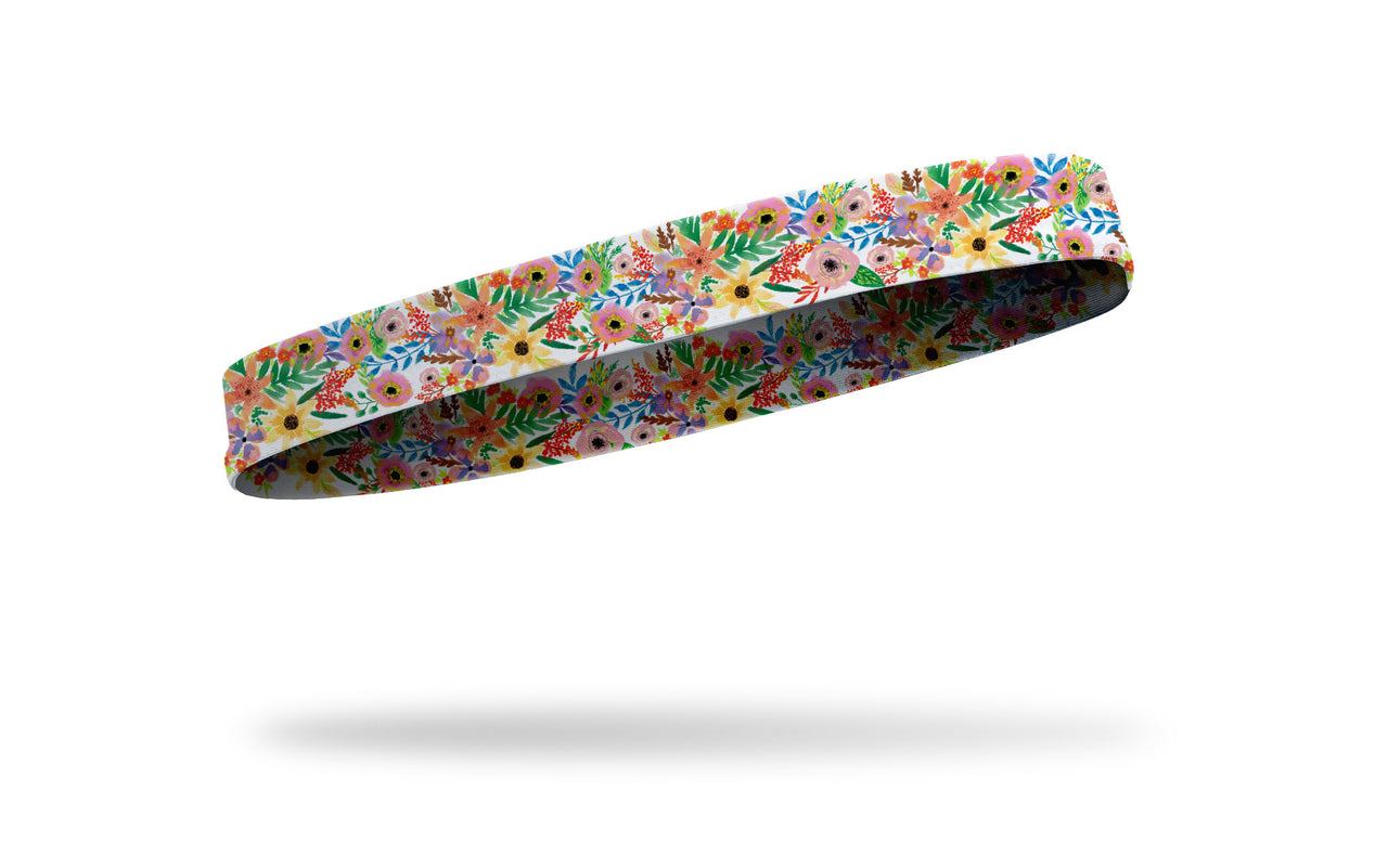 brightly colored flowers on thin band headband