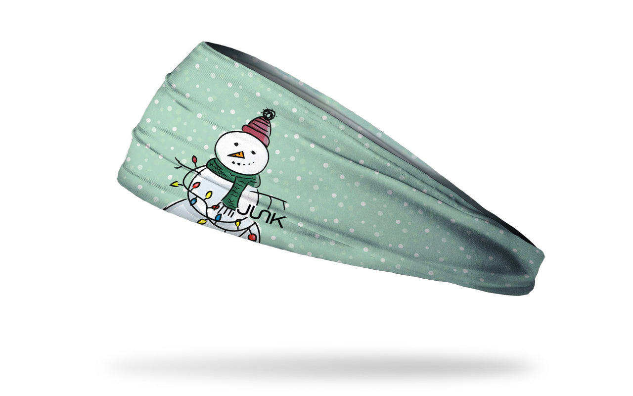 light blue winter christmas themed headband with snowflakes and snowman wearing knit hat and scarf