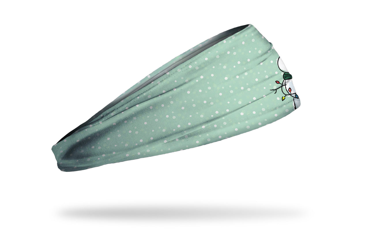 light blue winter christmas themed headband with snowflakes and snowman wearing knit hat and scarf