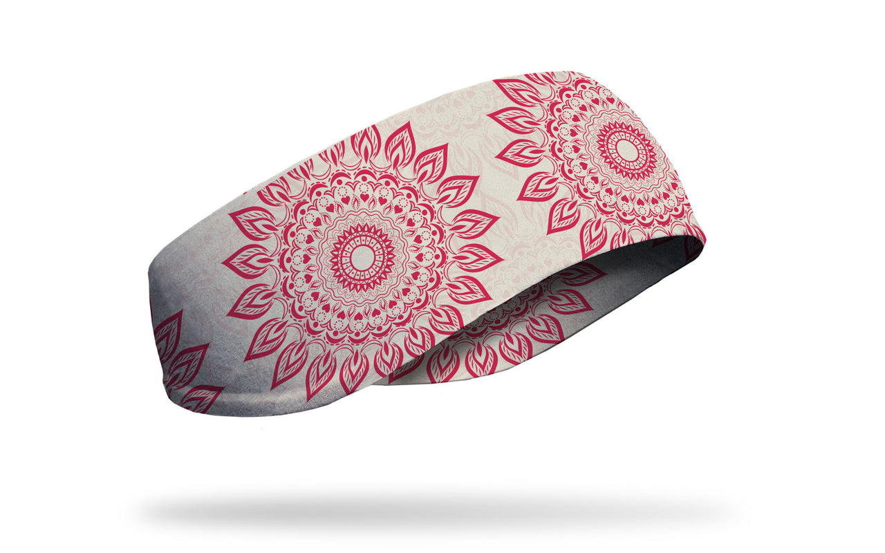 cream white JUNK ear warmer with oversized repeating red mandala design