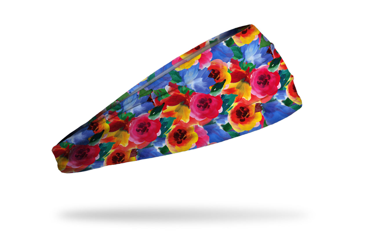 brightly colored headband with repeating pattern of flowers in watercolor