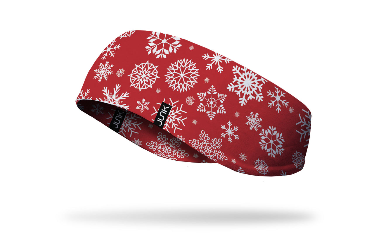 white snowflakes on red ear warmer left side