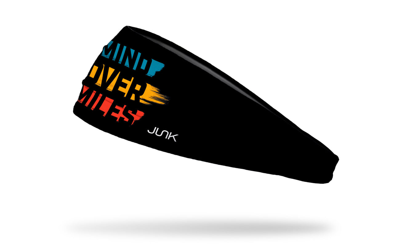 black headband with mind over miles wordmark blue yellow red