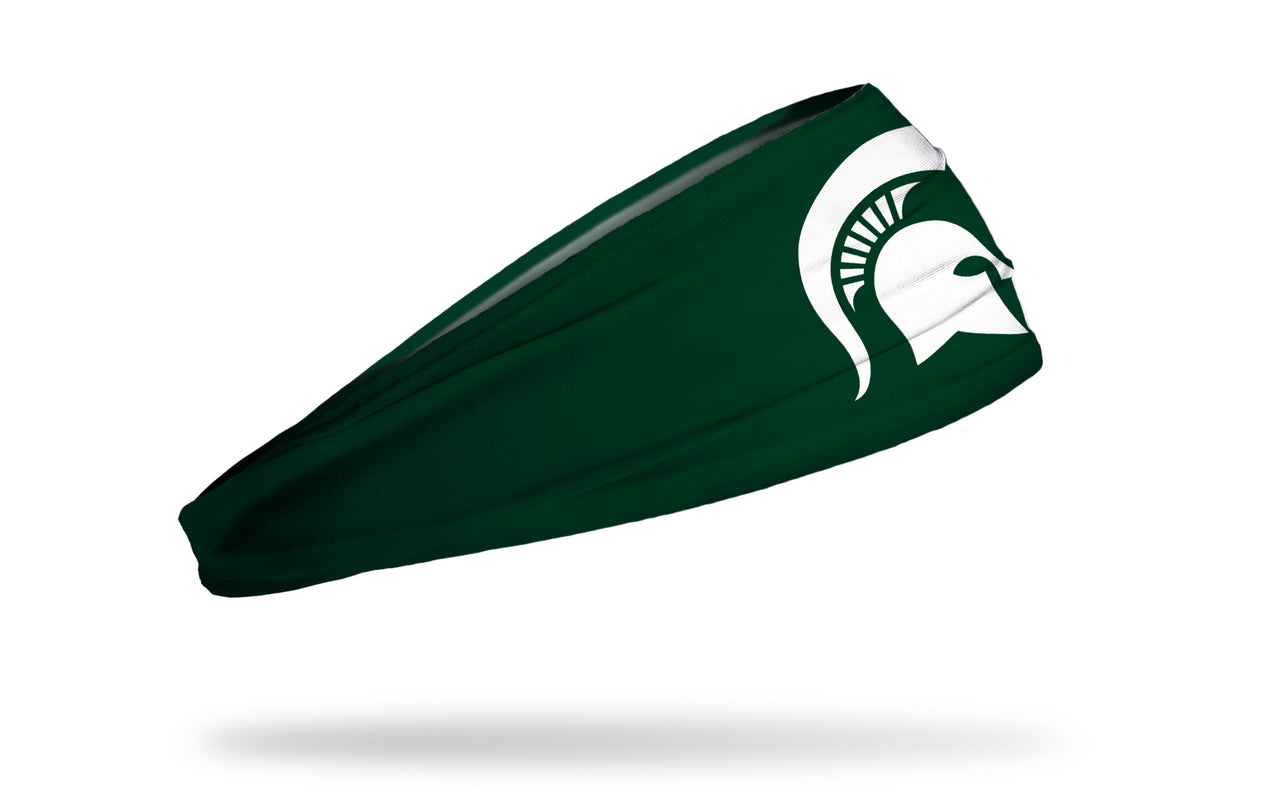 green headband with Michigan State University spartan logo in white