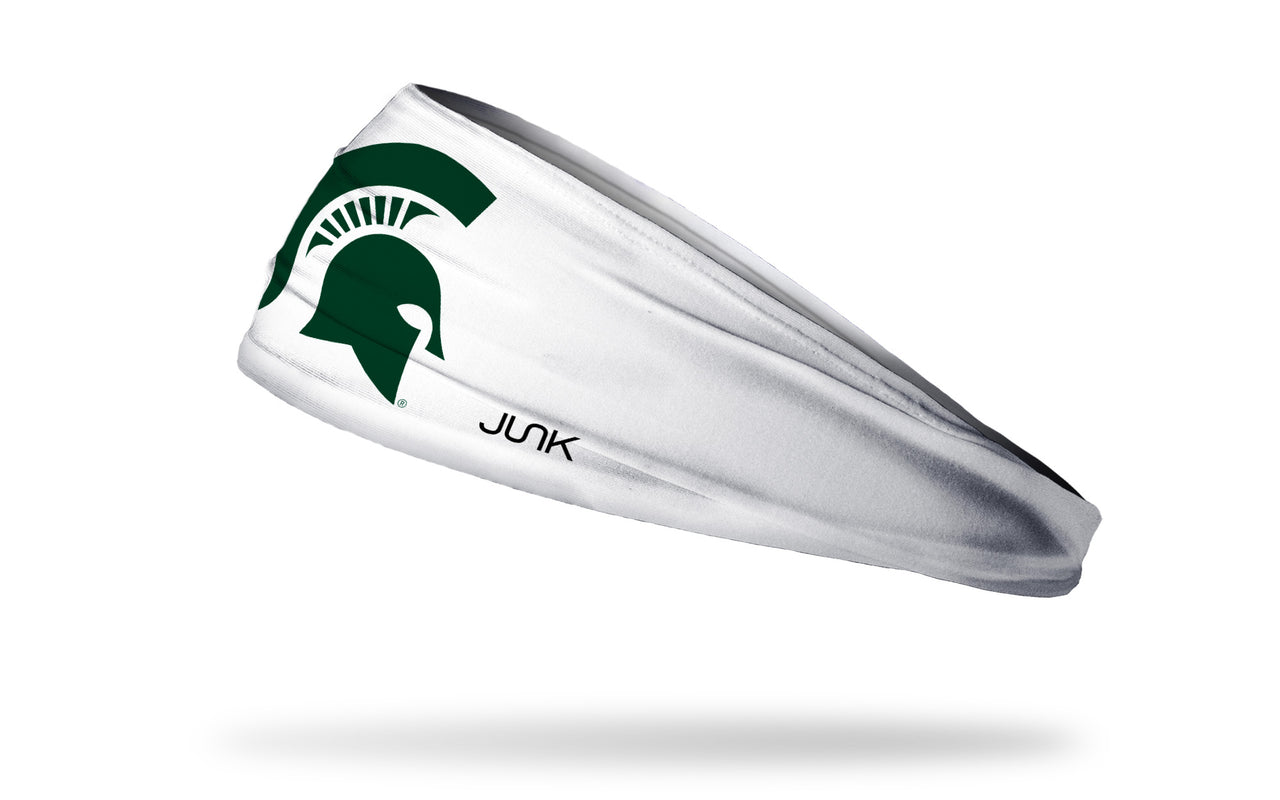 white headband with Michigan State University spartan logo in green