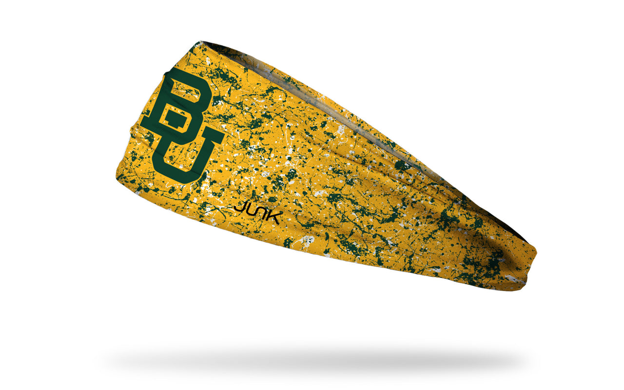gold headband with green paint splatter and Baylor University B U logo in green