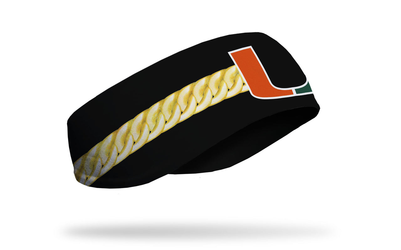 black ear warmer with gold chain print around and University of Miami U in green and orange