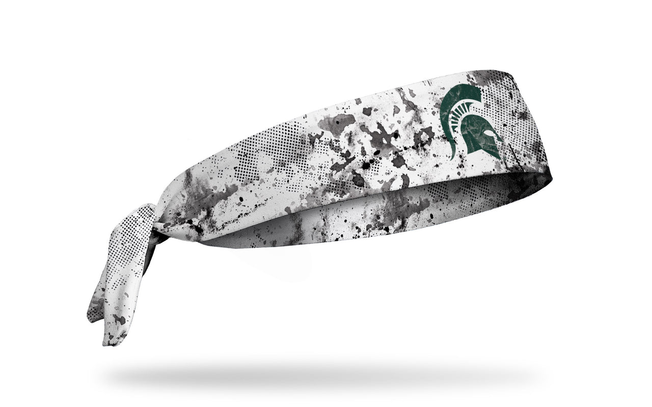 white headband with Michigan State University spartan logo in green with black grunge overlay