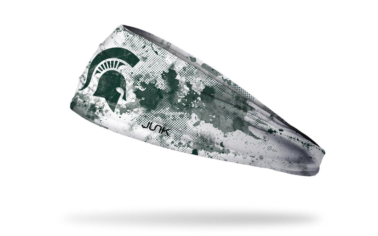 white headband with Michigan State University spartan logo in green with green grunge overlay