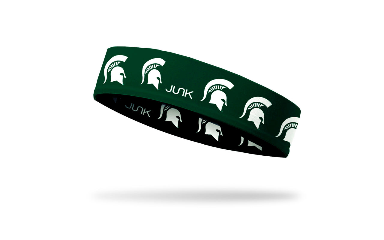 green headband with Michigan State University spartan logo repeating in white