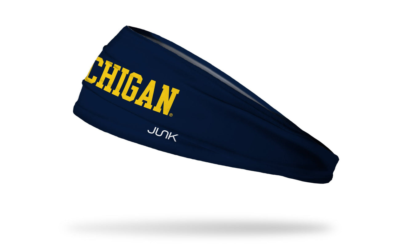navy headband with University of Michigan Michigan wordmark logo in gold