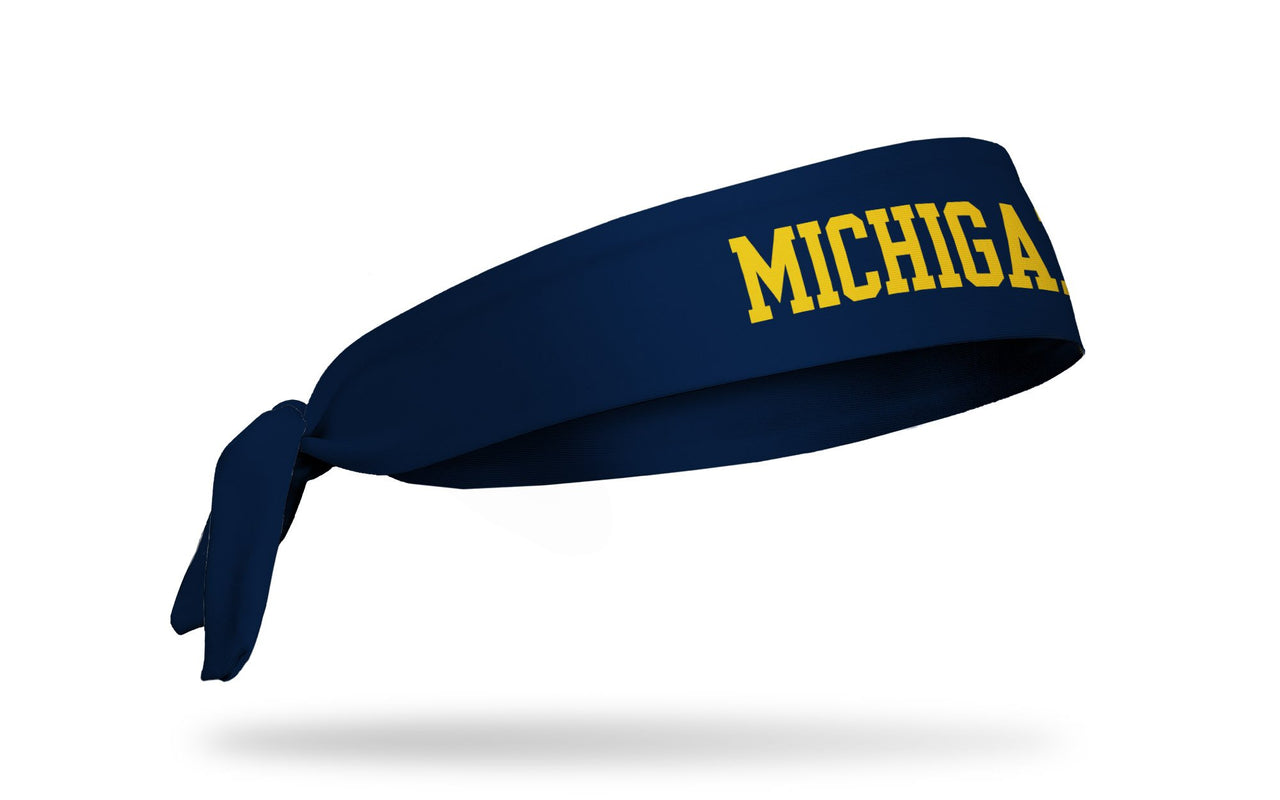 navy headband with University of Michigan Michigan wordmark logo in gold
