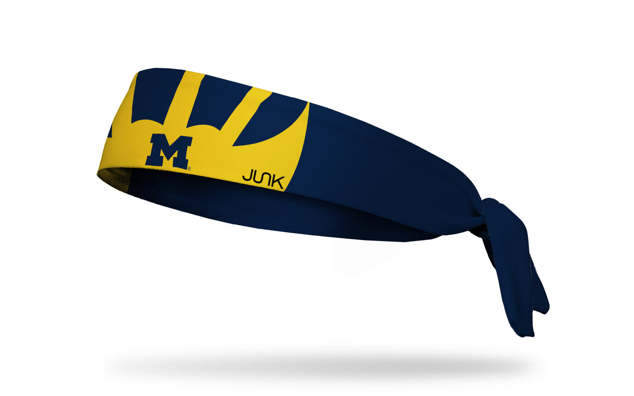 navy headband with University of Michigan winged helmet design in gold