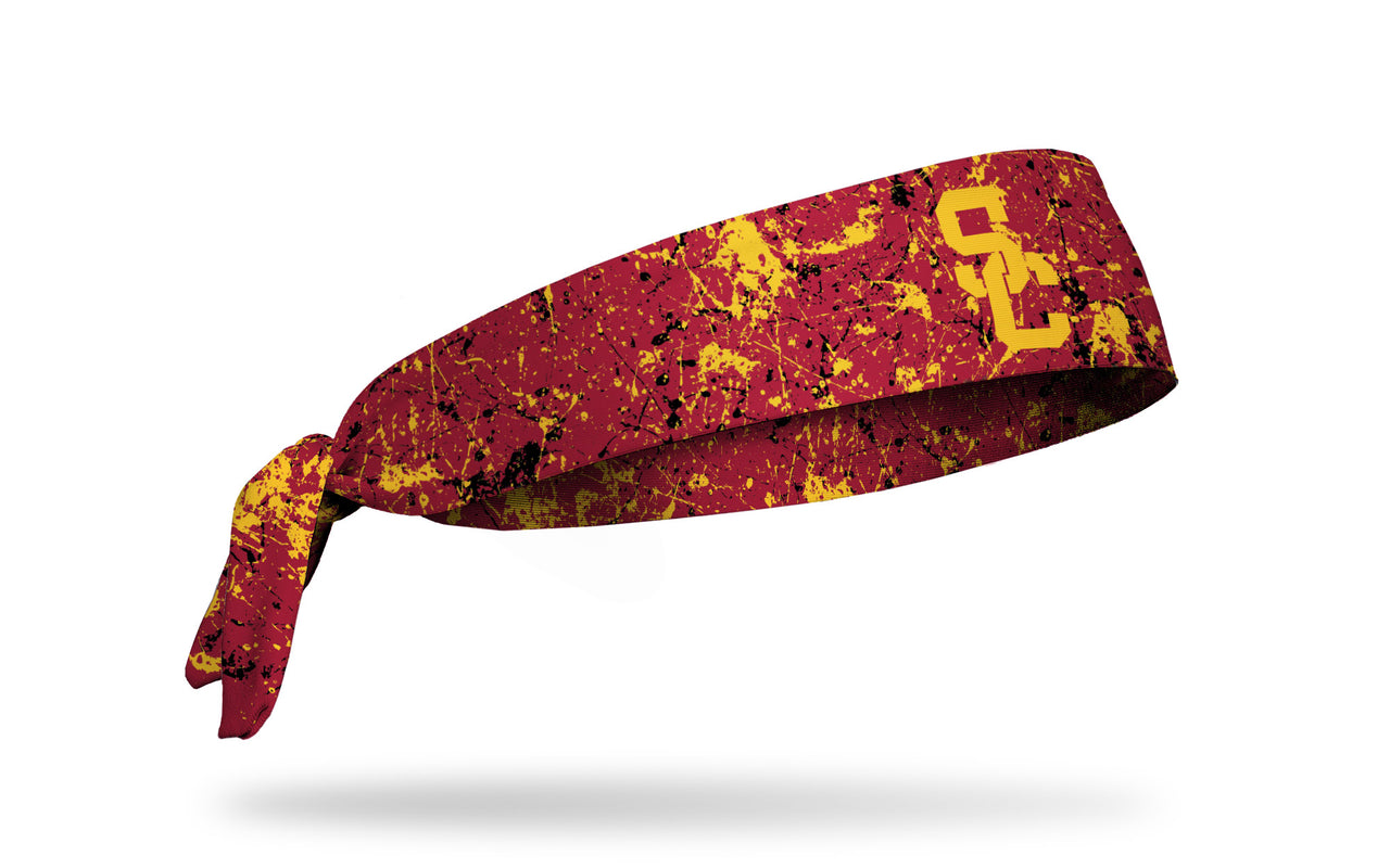 cardinal headband with paint splatter design and University of Southern California logo
