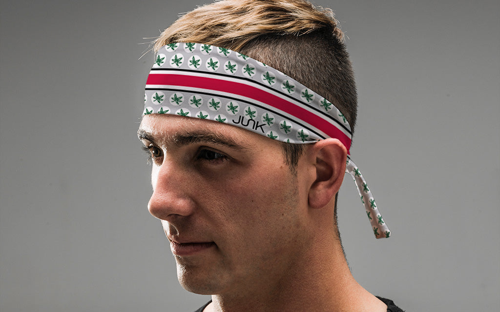 grey and white headband with red band line and Ohio State University Buckeyes logo repeating in green