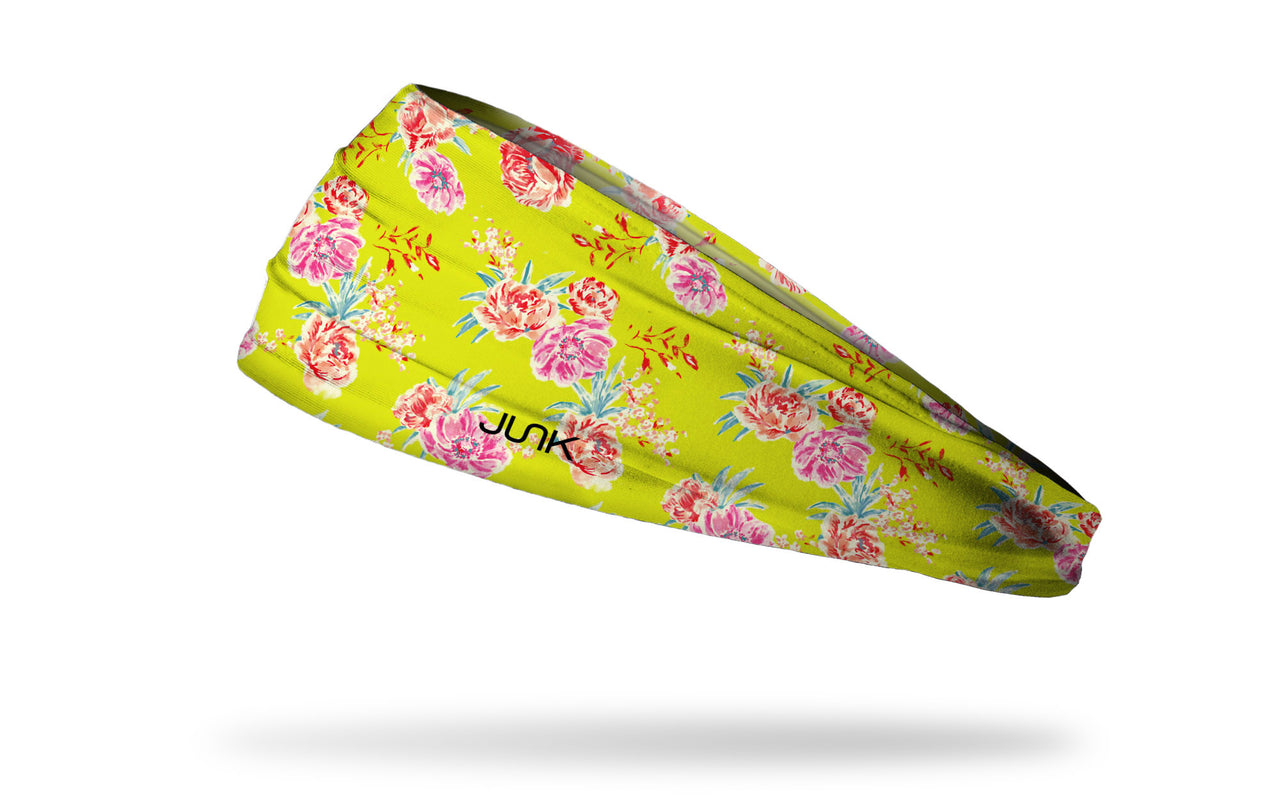 bright yellow headband with repeating pattern of prim and proper pretty pink flowers