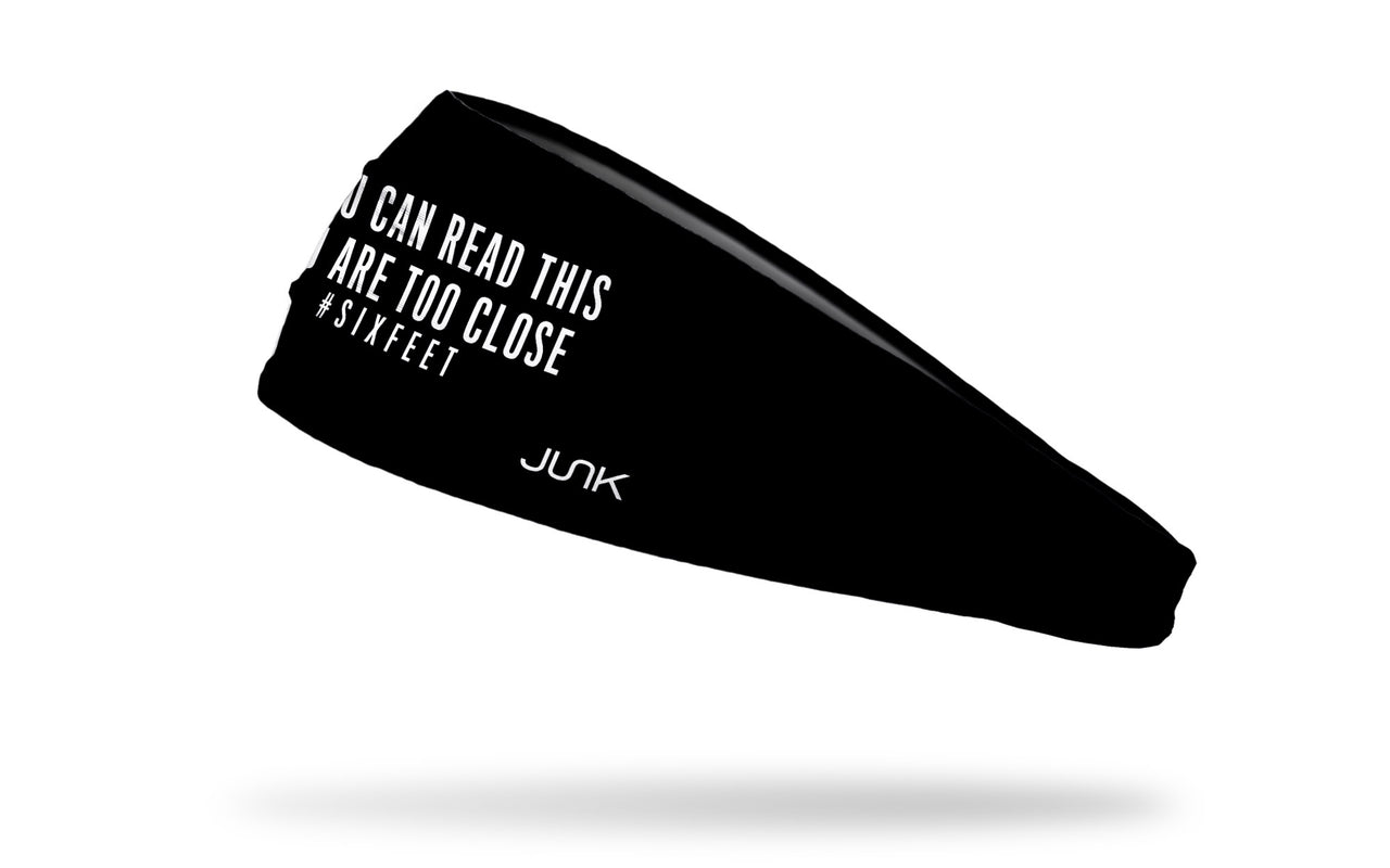 black headband with if you can read this you are too close hashtag six feet in white letters front center