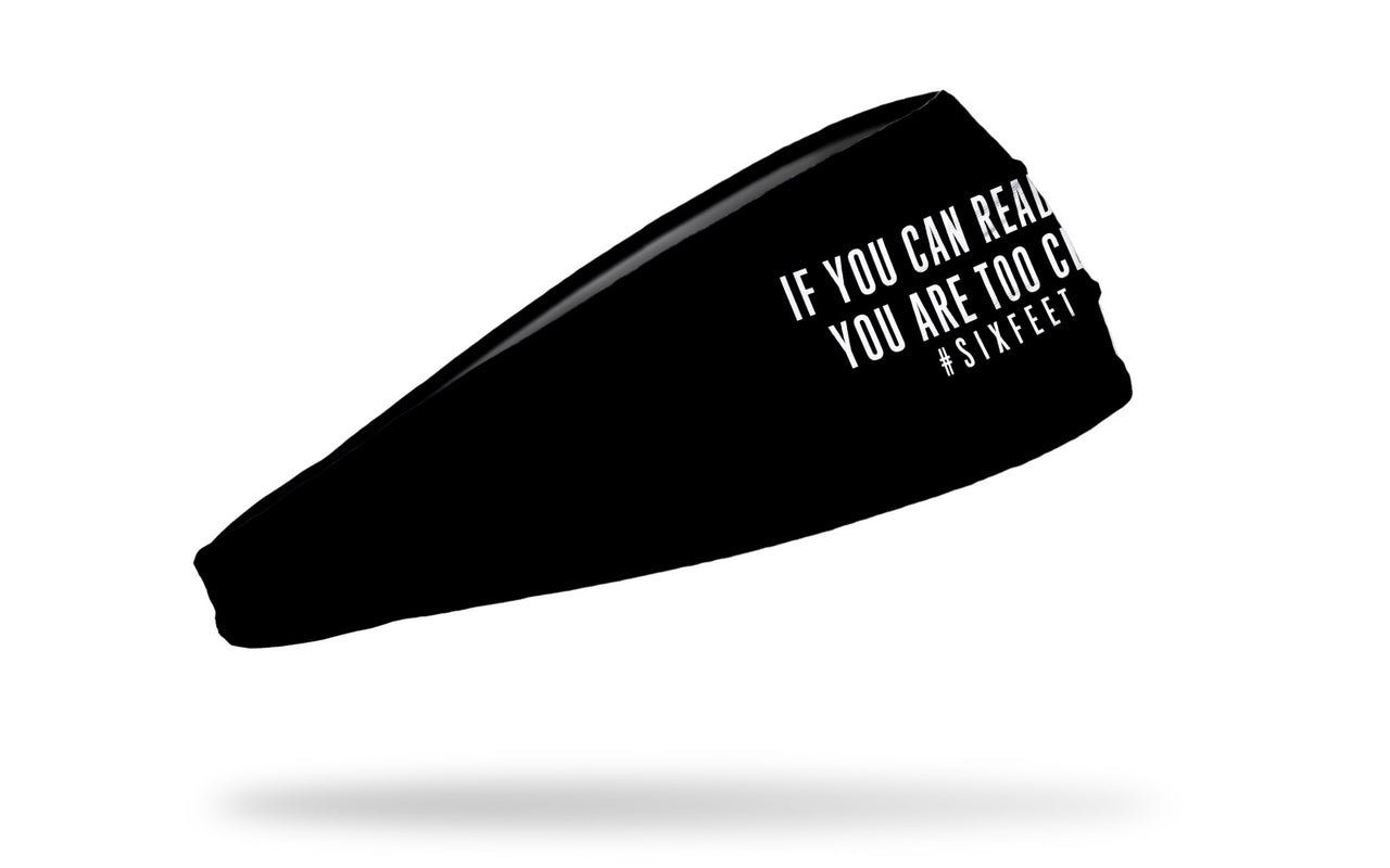 black headband with if you can read this you are too close hashtag six feet in white letters front center