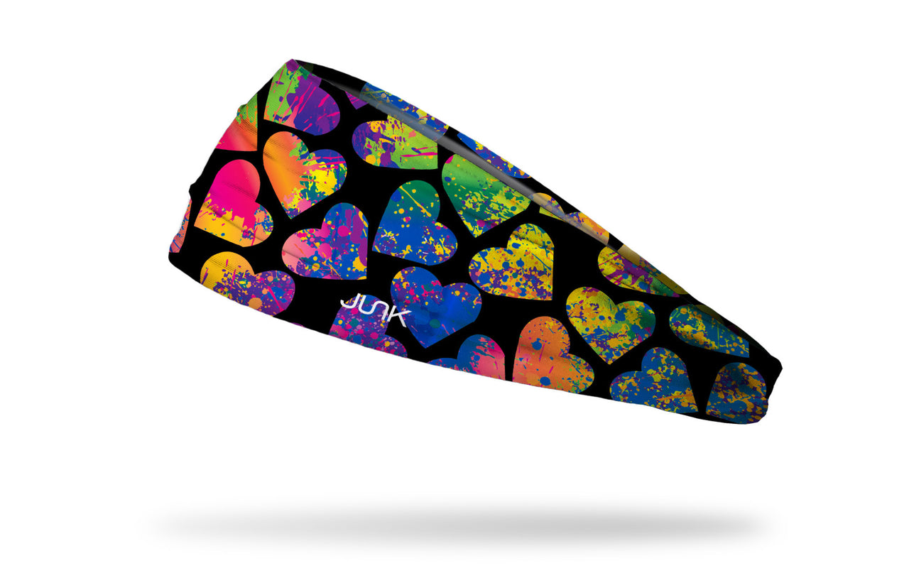 black headband with bright and colorful paint splatter hearts design
